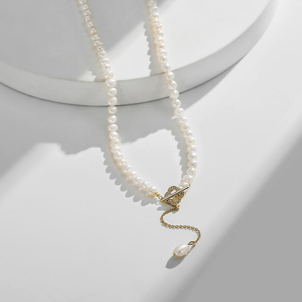 Champagne gold womens necklace with a flower-inspired alloy pendant and ball bead chain, designed in Korean style with fresh water pearl elements.