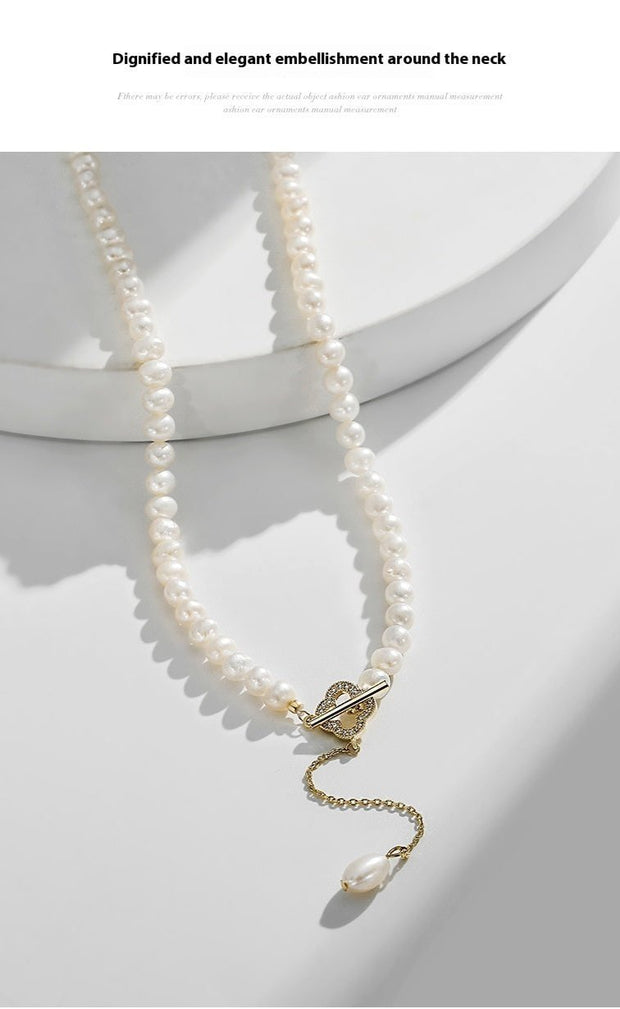 14k Gold Freshwater Pearl Necklace with genuine pearls in classic white or alluring purple, featuring an adjustable flat gold chain for versatile wear.