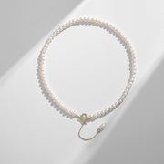 14k Gold Freshwater Pearl Necklace with genuine pearls in classic white or alluring purple, featuring an adjustable flat gold chain for versatile wear.