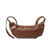 Brown genuine leather crossbody handbag with dumpling shape, soft texture, and single shoulder strap, perfect for women seeking luxury and functionality.